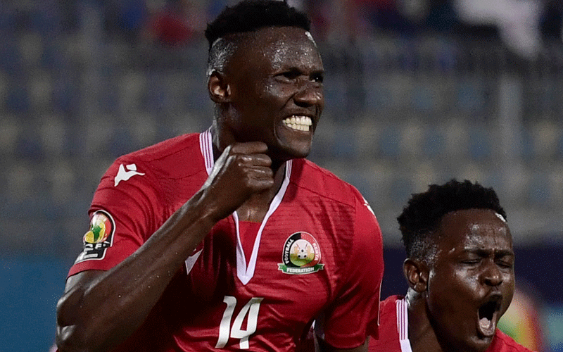 Harambee Stars’ forward Michael Olunga celebrates with team mate Eric Ouma after he scored a goal against Tanzania in the 2019 Africa Cup of Nations in Egypt. PHOTO/Print