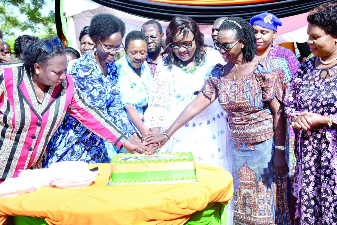 Maendeleo ya Wanawake Organisation leaders cut a cake to mark their 70th anniversary in Kisumu, yesterday. PHOTO/Viola Kasome