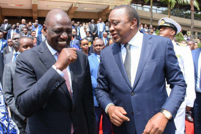 Deputy President William Ruto and President Uhuru Kenyatta share a light moment at KICC on July 19, 2019 PHOTO/ DPPS