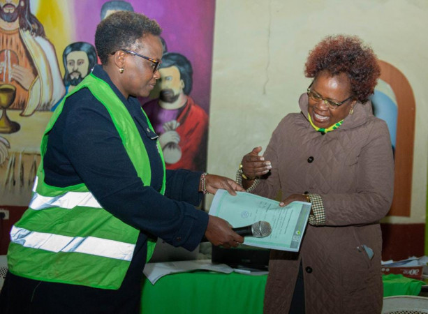Kandara MP-elect Alice Wahome receiving her certificate from IEBC officer.
PHOTO/Wangari Njuguna
