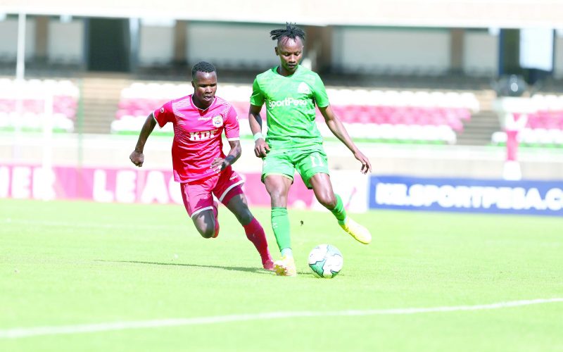 John Macharia of Gor Mahia FC (R) defends the ball against Stephen Etyang of Ulinzi Stars during their FKF-PL match played at Kasarani Stadium, yesterday.