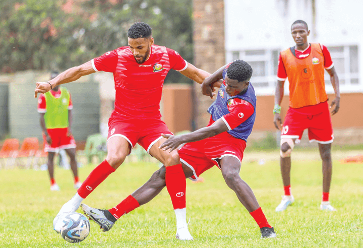 Jonah Ayunga (left) shields the ball during Kenya’s Harambee Stars training in Nairobi yesterday. PHOTO/ FKF