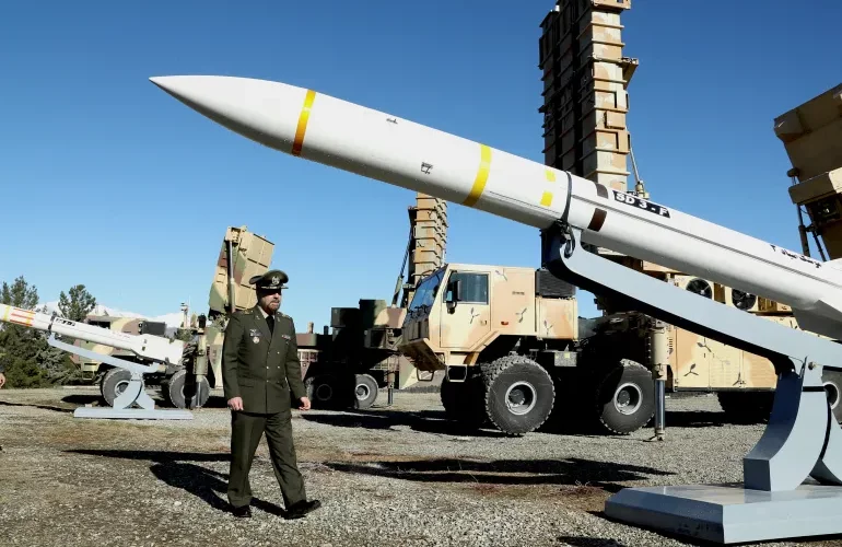 Iran's Defense Minister Brigadier- General Mohammad Reza Ashtiani inspects an Iranian missile during an unveiling ceremony in Tehran.
