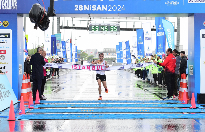 Moroccan runner Hicham Amghar crosses the finishing line of the 19th Istanbul Half Marathon. PHOTO/IHA Photo