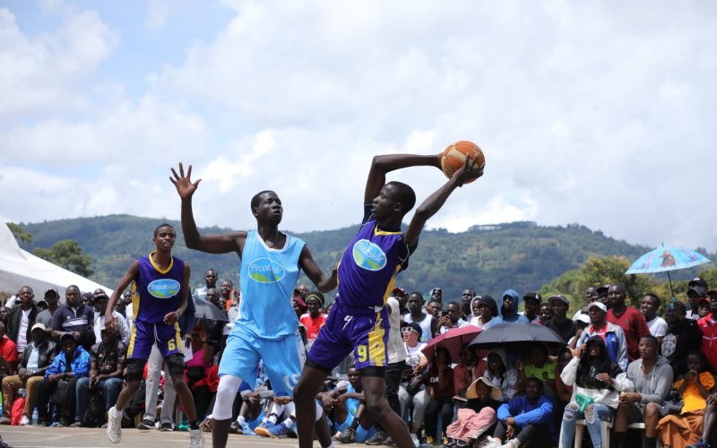 Alex Ochieng of Dr Aggrey High School from Taita Taveta Country (L) battled it out with Jan Ogutu of Agoro Sare from Nyanza during the KSSSA basketball finals at Machakos School. PHOTO/Phillip Kamakya